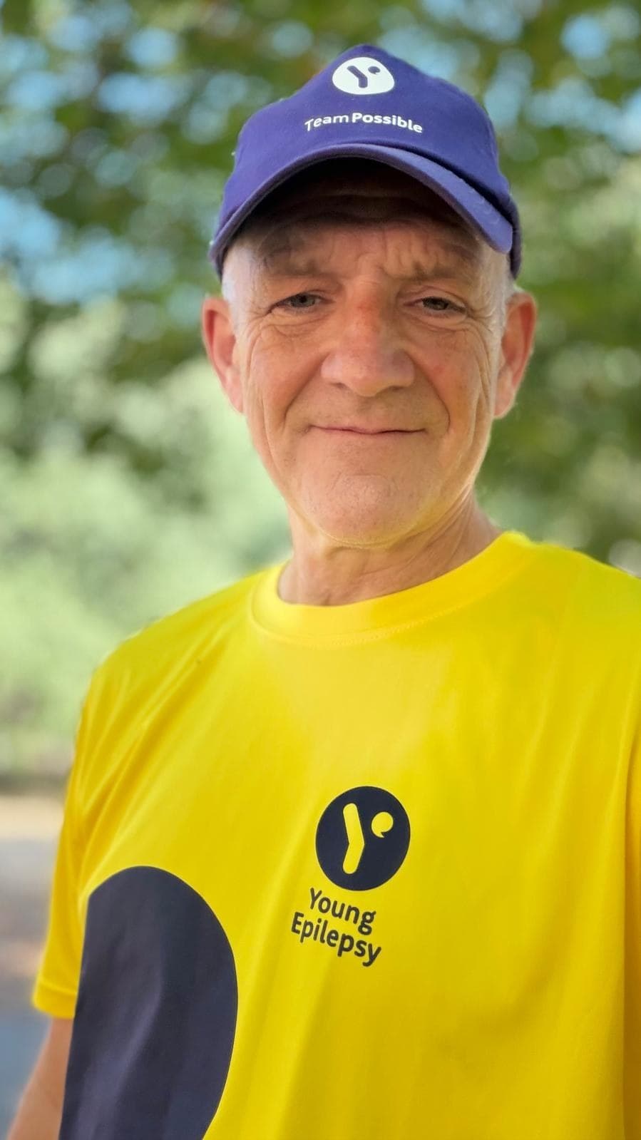 Rory Coleman in a Young Epilepsy Team Possible cap and running shirt