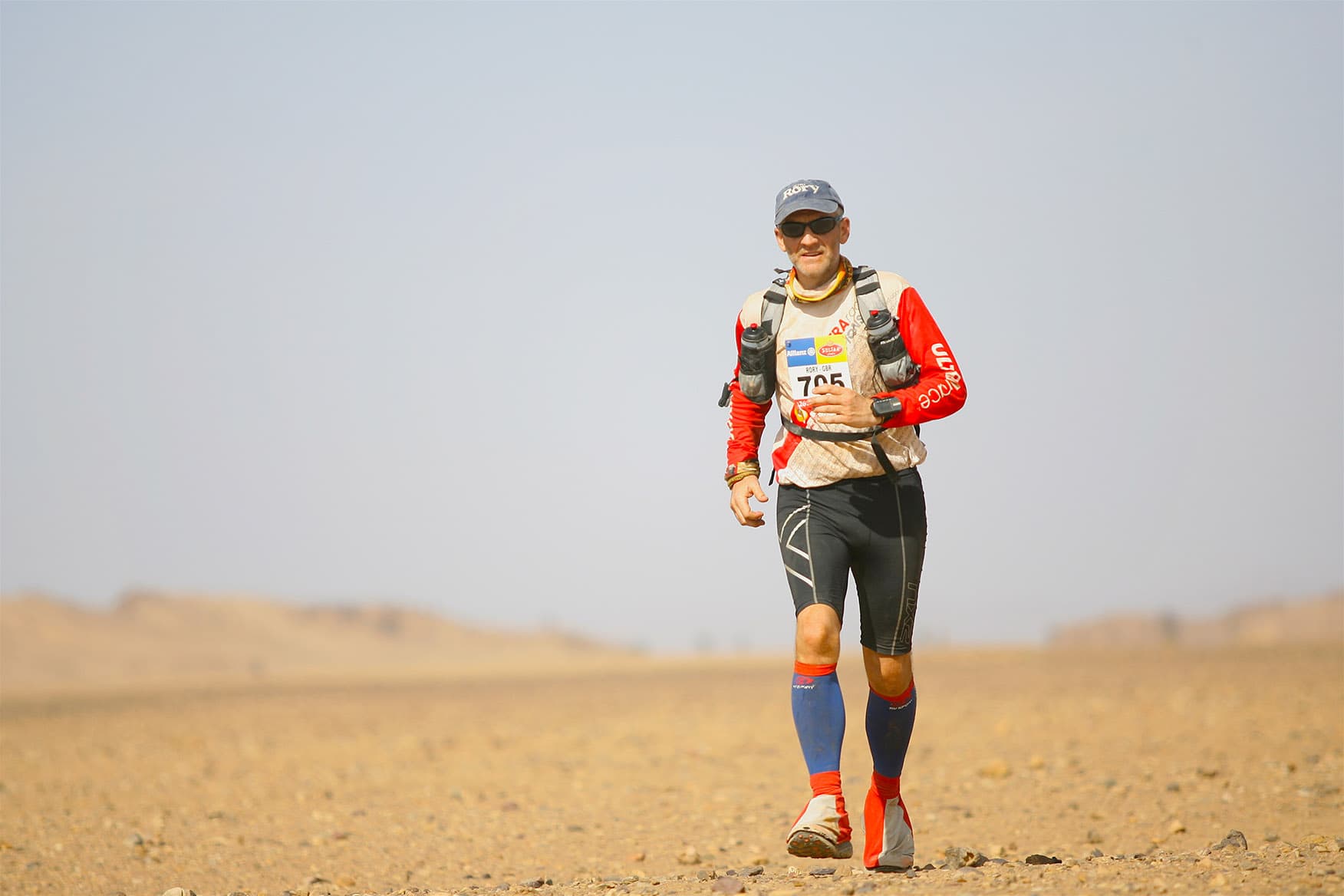 Rory Coleman running across open desert